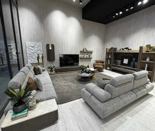 Ensemble Hermes Dôme Canapes en tissu gris avec coussins marron, design moderne et assise généreuse.